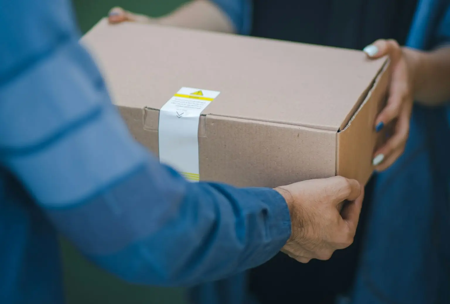 person giving brown box